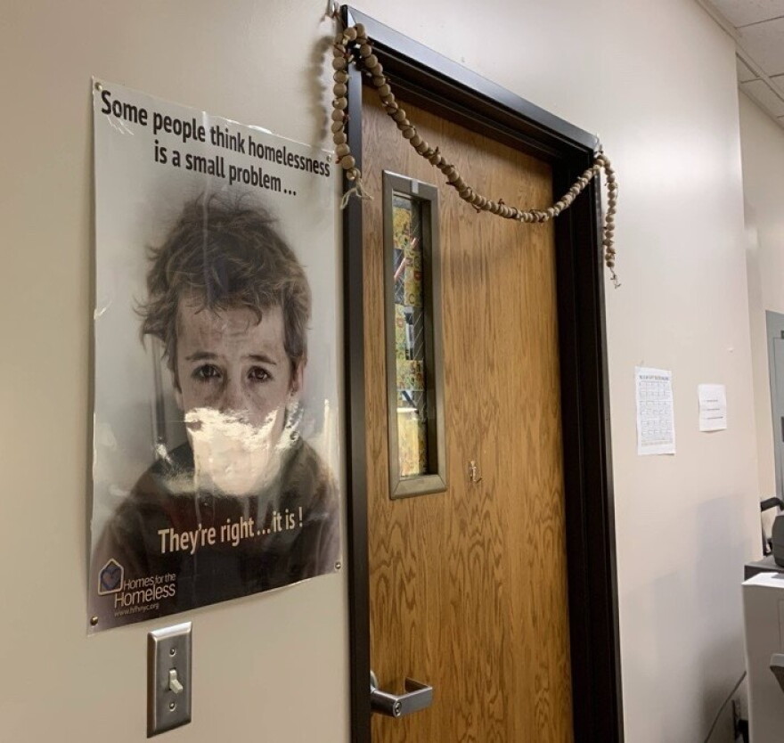 A poster about homelessness hangs outside Kristi O’Meara's door. The McKinney-Vento liaison for Lexington Public Schools since 2008, O'Meara has offices in both the middle and high school.