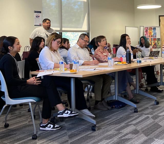 Latino students and community members at a Washington educational event.