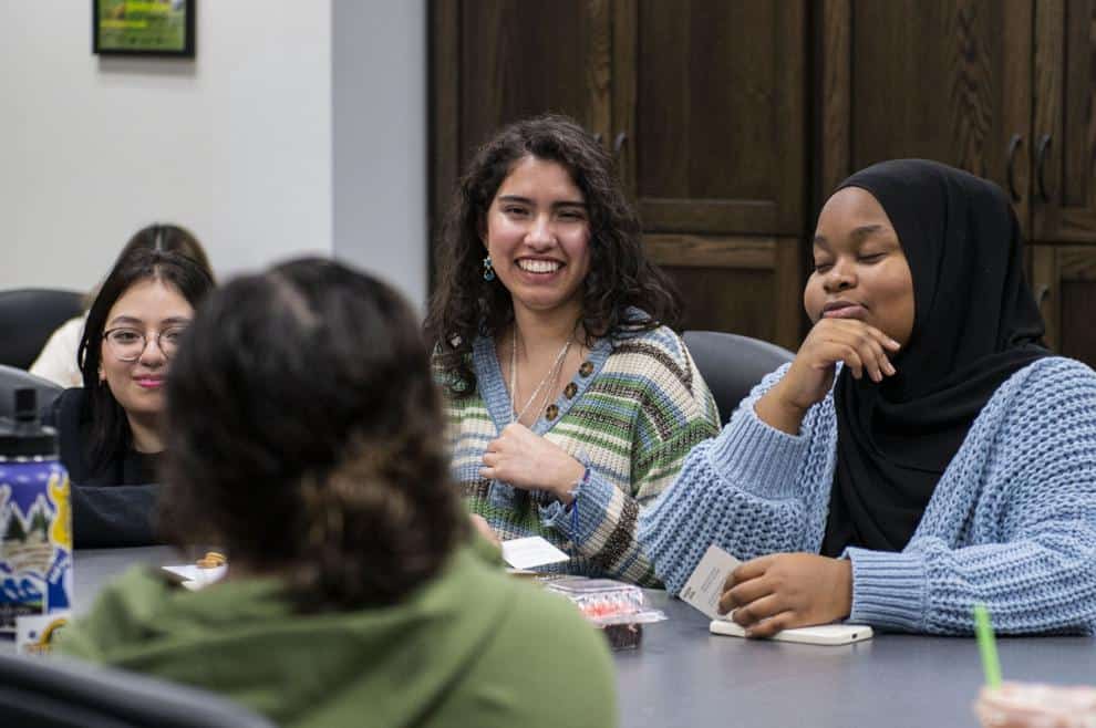 Latino students engaging in discussion at Idaho's first Hispanic-serving institution meeting.