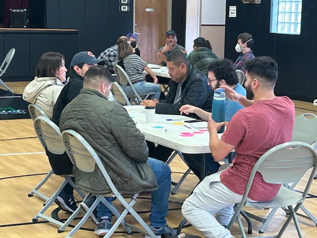 Community meeting of local news outlets in Chicago suburb for engagement reporting.