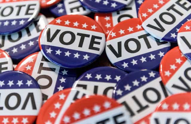 Vote buttons with patriotic colors emphasizing the importance of voting and civic responsibility.