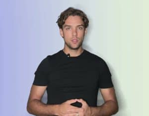 News Team Member – Latino News Network Latino News Network news team member in a black t-shirt, standing confidently.