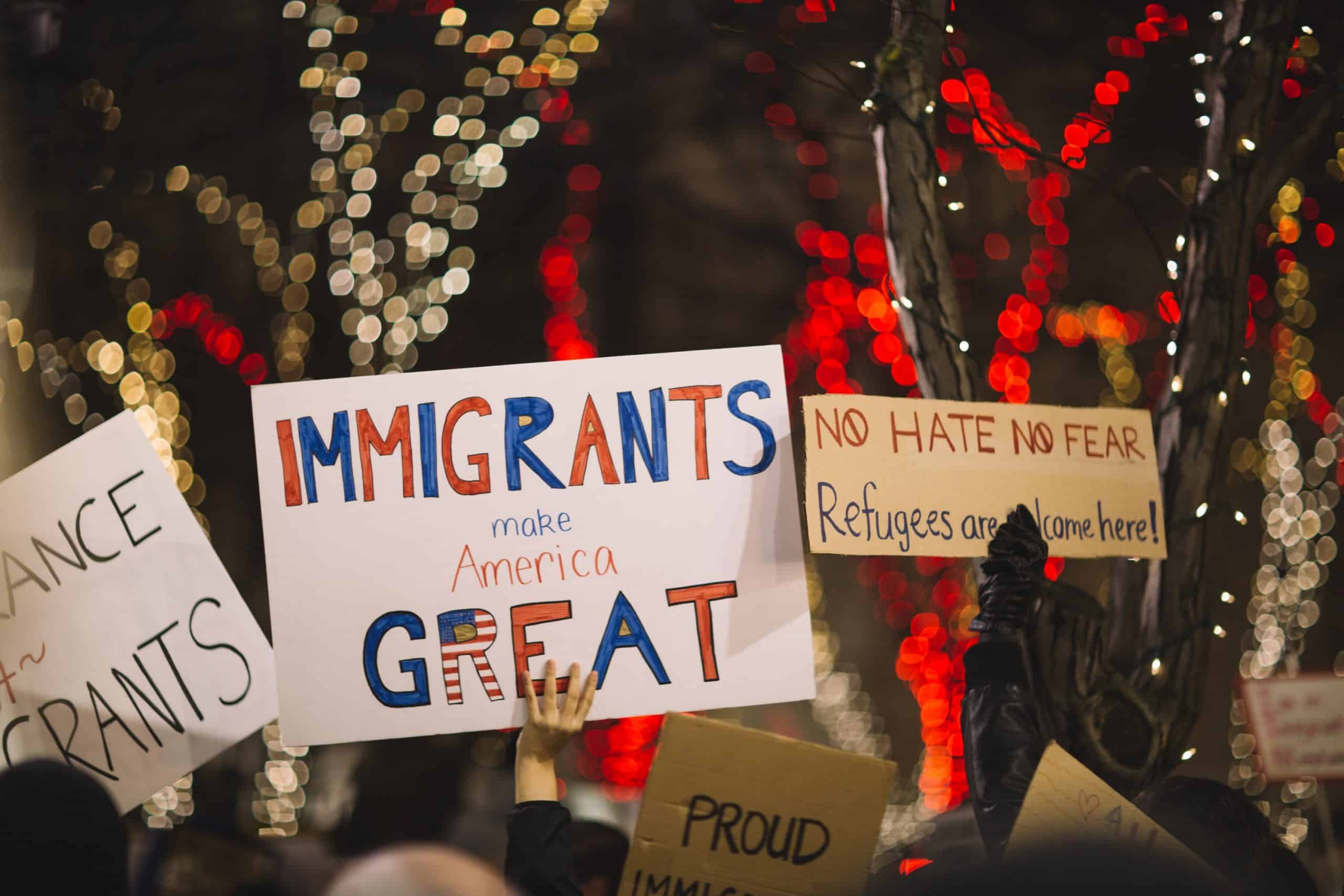 Immigrants advocating for voting rights and inclusion at a rally.