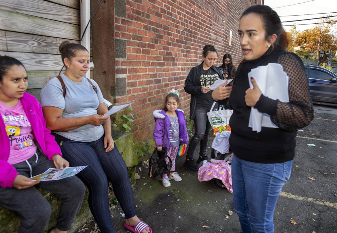 Undocumented woman leads community meeting for better healthcare access.
