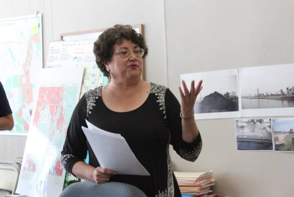 Environmental Justice leader Peggy Salazar speaks passionately at a community event.
