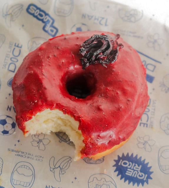 Delicious glazed donut with cherry topping from Sazón de Washington. Perfect treat for donut lovers.