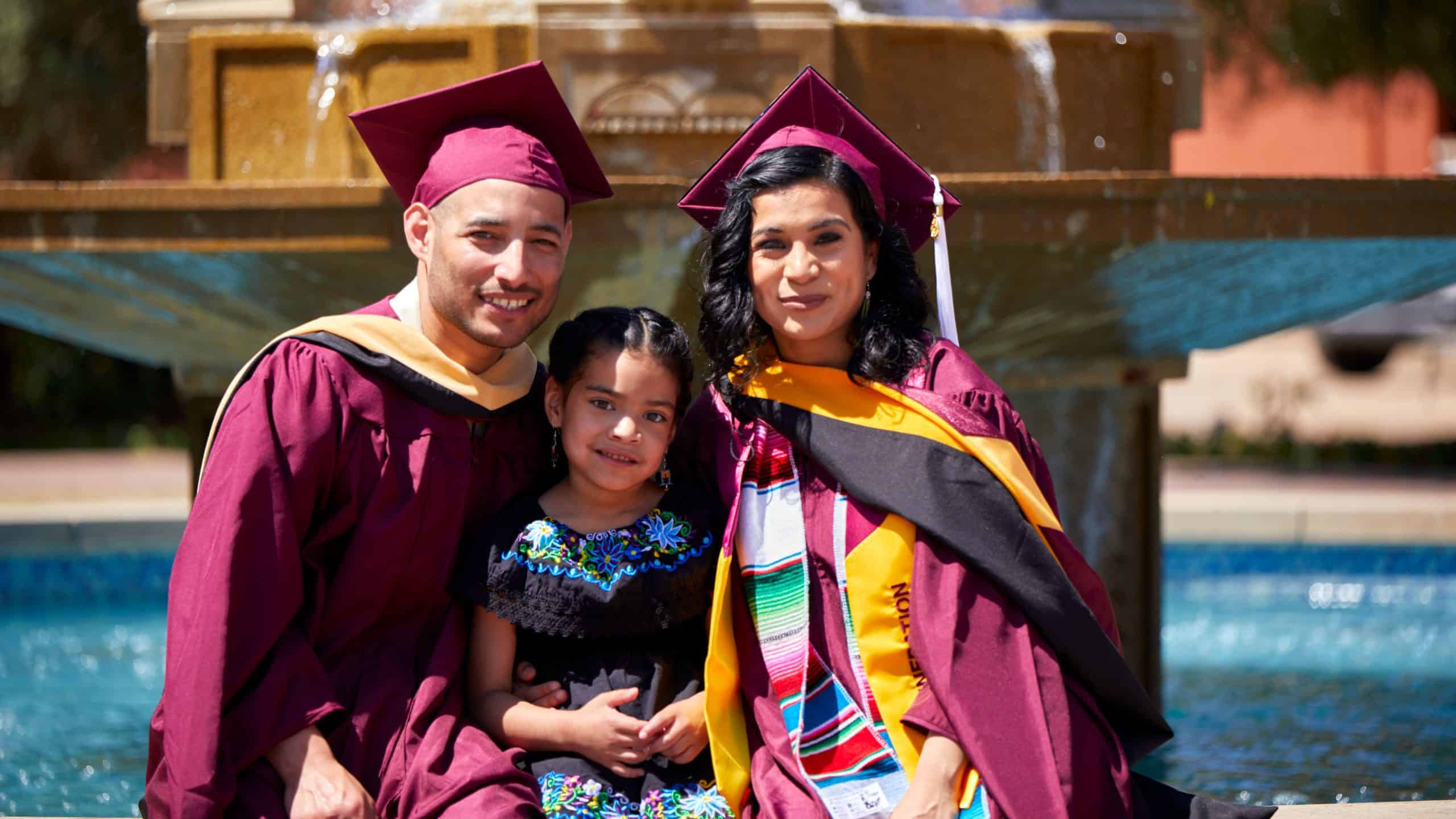 Happy graduates in caps and gowns celebrating educational achievement.