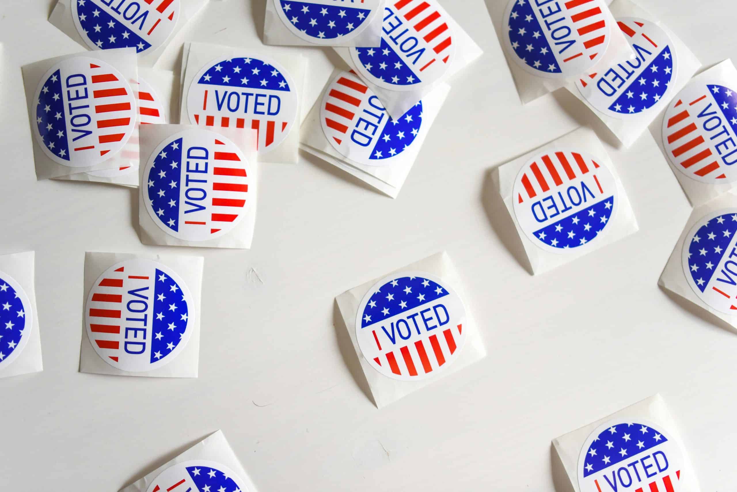 Latino voter stickers with patriotic design for election participation.