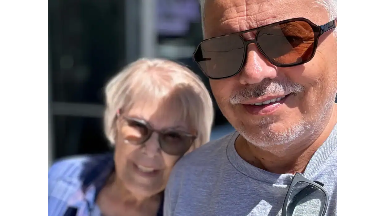 Latino family members smiling outdoors in Nevada, emphasizing community engagement.