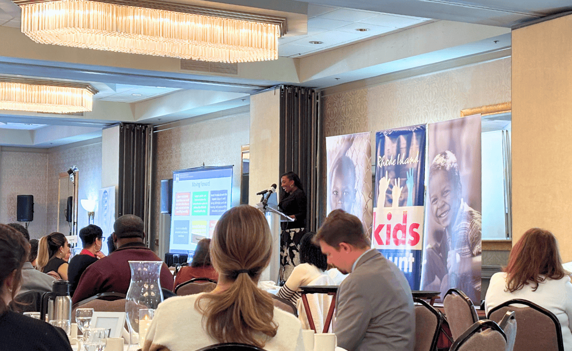 Early childhood advocacy event with speakers and audience focused on kids' rights and community coll.