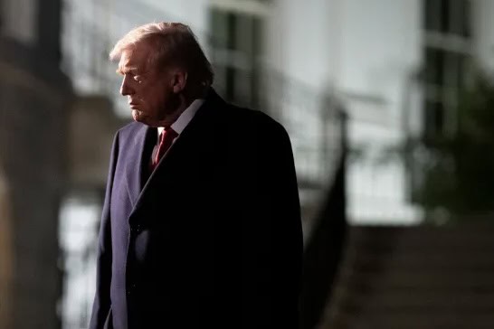 Former President Donald Trump outdoors, reflecting during political tensions.